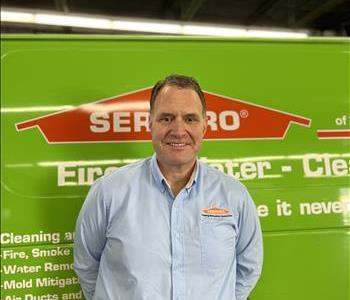 Male in front of SERVPRO equipment
